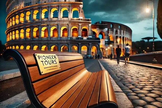 A breathtaking twilight scene at the Colosseum in Rome, featuring warm golden lights and a Pioneer Tours plaque on a bench.